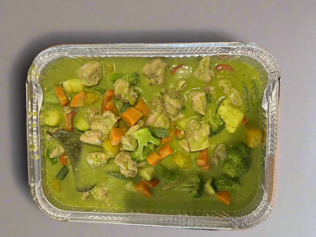 A Freshly Made Thai Green Chicken Curry in take away Container. 